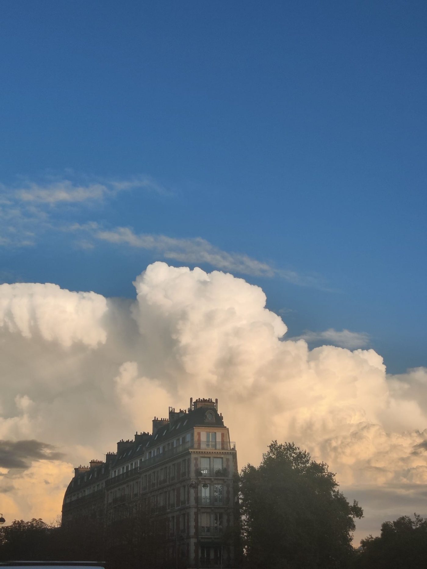 Clouds over a Parisian streetscape